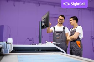 two service technicians at commercial printer