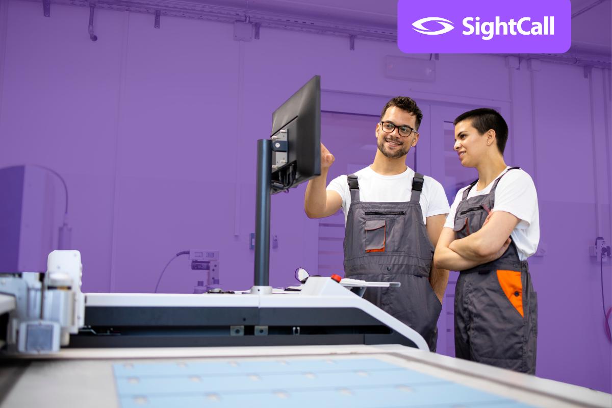 two service technicians at commercial printer