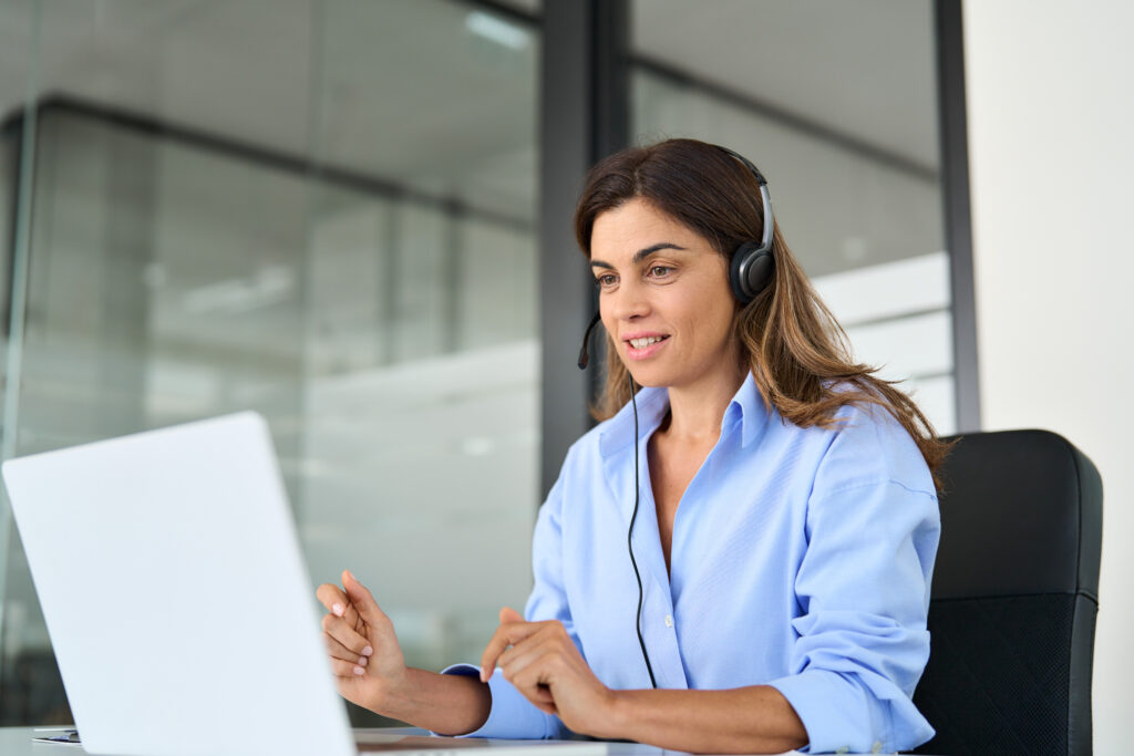 Call center woman at computer with headset